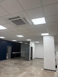 Office suspended grid ceiling with cassette air conditioning
