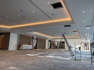 After: finished floor with coffered lit ceiling