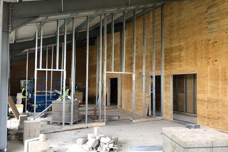 Metal stud partitions set out on site